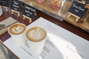 coffee and cakes on shop counter